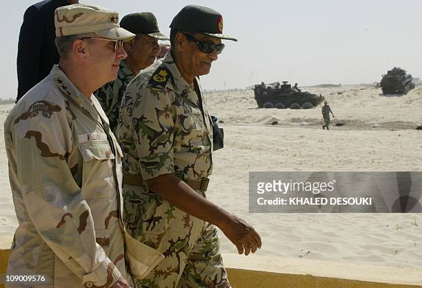 General John Abizaid , the head the US Central Command, walks with Egyptian Defense Minister Hussein Tantawi during the Bright Star joint war games...