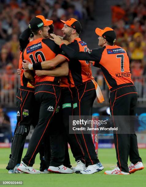 Andrew Tye of the Perth Scorchers celebrates with his team after a wicket during the Big Bash League match between the Perth Scorchers and the...