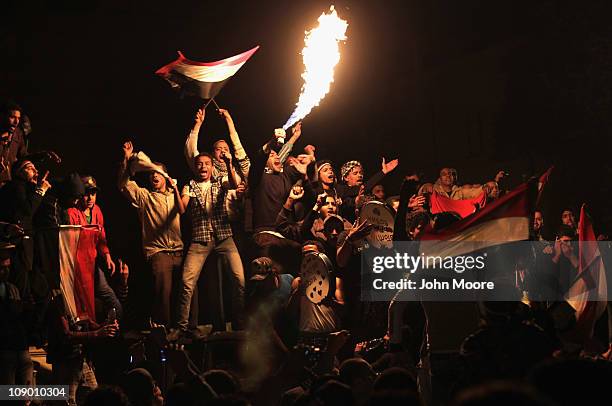 Egyptians celebrate in Tahrir Square upon hearing the news of the resignation of Egyptian President Hosni Mubarak on February 11, 2011 in Cairo,...