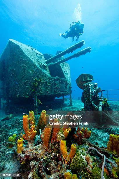 scuba diver approaches shipwreck - shipwreck bildbanksfoton och bilder