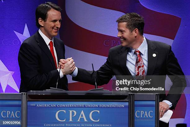 Former Minnesota Governor Tim Pawlenty is wlecomed to the stage by Rep. Sean Duffy during the Conservative Political Action Conference at the...