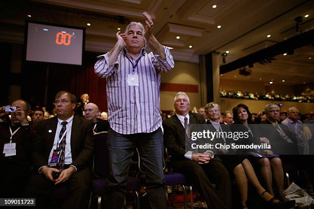 An enthusiastic conservative stands to applaud for Rep. Ron Paul as he addresses the Conservative Political Action Conference at the Marriott Wardman...