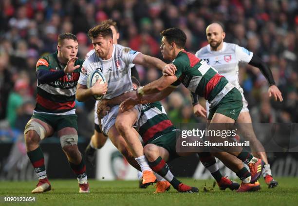 Mark Atkinson of Gloucester Rugby is tackled by Matt Toomua of Leicester Tigers during the Gallagher Premiership Rugby match between Leicester Tigers...