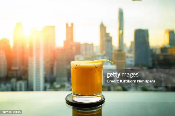 cocktail om bangkok city view point from rooftop of building, blue sky and city light, bangkok is the most populated city in southeast asia. bangkok , thailand - cocktail sonnenuntergang stock-fotos und bilder