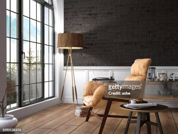 innenraum mit sessel und bücher und ausblick - table brick wall wood stock-fotos und bilder