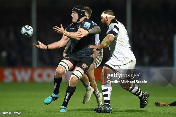 Mitch Lees of Exeter feeds a pass under pressure from John Afoa of Bristol during the Gallagher Premiership Rugby match between Exeter Chiefs and...