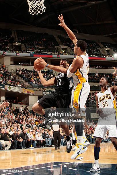 Lazar Hayward of the Minnesota Timberwolves shoots against Danny Granger of the Indiana Pacers on February 11, 2011 at Conseco Fieldhouse in...