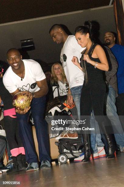 Terrell Owens and Adrienne Bailon attend the 81 Cares Bowl presented by Terrell Owens and GQ Magazine at Star Lanes On The Levee on December 6, 2010...