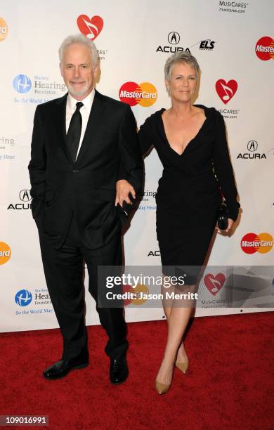 Christopher Guest and actress Jamie Lee Curtis arrive at the 2011 MusiCares Person of the Year Tribute to Barbra Streisand held at the Los Angeles...