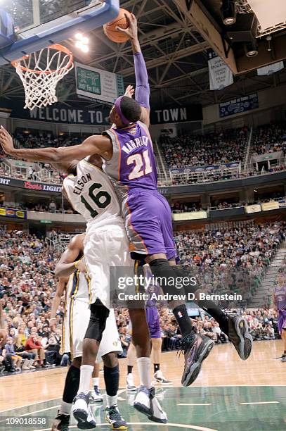 Hakim Warrick of the Phoenix Suns goes for the dunk over Francisco Elson of the Utah Jazz at EnergySolutions Arena on February 11, 2011 in Salt Lake...