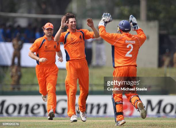 Pieter Seelaar of Netherlands celebrates with Wesley Barresi after taking the wicket of Upal Tharanga during the Sri Lanka v Netherlands 2011 ICC...