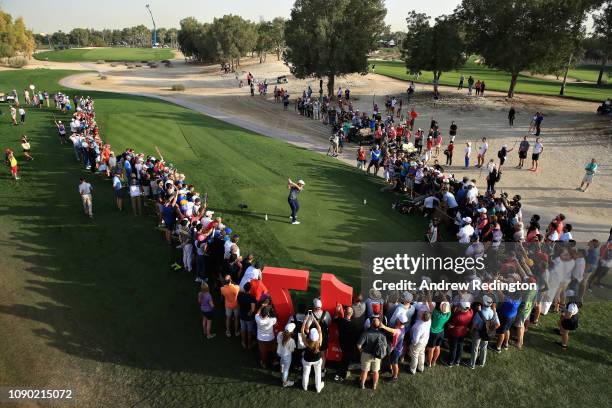 Bryson Dechambeau of United States takes his tee shot on hole seventeen during Day Four of the Omega Dubai Desert Classic at Emirates Golf Club on...