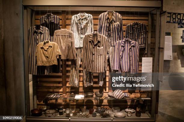 Prison clothing worn by victims of the Holocaust on display as people visit the Yad Vashem museum to see the exhibition and commemorate International...