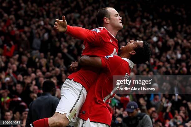 Wayne Rooney of Manchester United celebrates with teammate Nani after he scores a goal from an overhead kick during the Barclays Premier League match...