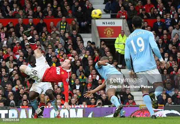 Wayne Rooney of Manchester United scores their second goal during the Barclays Premier League match between Manchester United and Manchester City at...