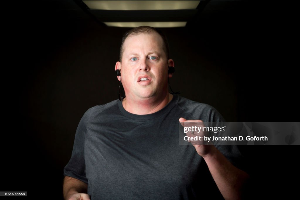 Large Man Running on Treadmill