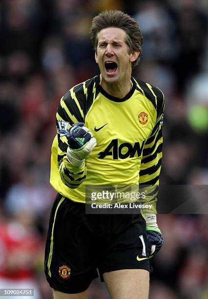 Goalkeeper Edwin van der Sar of Manchester United celebrates as teammate Nani scores the opening goal during the Barclays Premier League match...