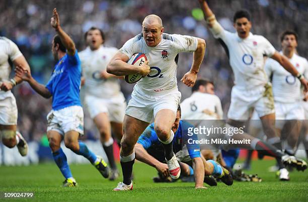 Mike Tindall of England breaks through to score his team's fourth try during the RBS 6 Nations Championship match between England and Italy at...