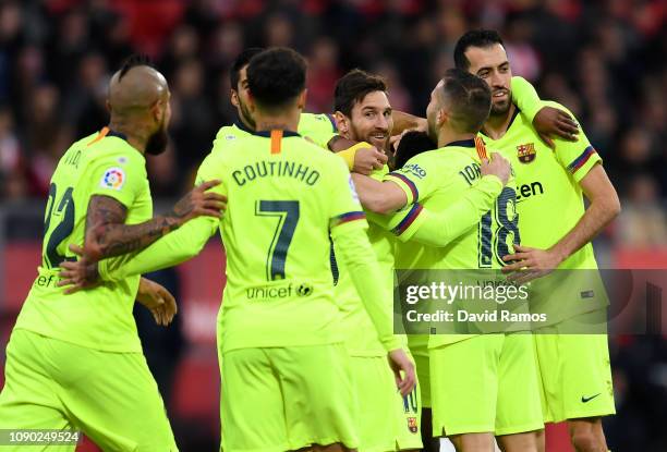 Lionel Messi of Barcelona celebrates with his team mates after Nelson Semedo of Barcelona score the teams first goal during the La Liga match between...