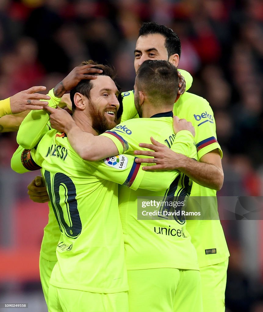 Lionel Messi of Barcelona celebrates with his team mates after Nelson