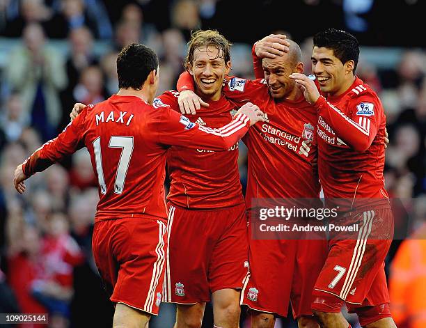 Raul Meireles of Liverpool celebrates his goal with the Liverpool team during the Barclays Premier League match between Liverpool and Wigan Athletic...