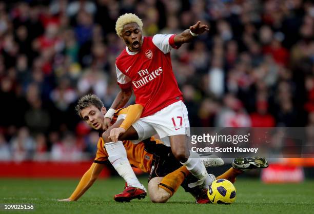 Kevin Doyle of Wolves tangles with Alex Song of Arsenal during the Barclays Premier League match between Arsenal and Wolverhampton Wanderers on...
