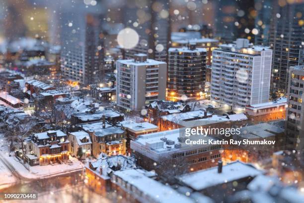 snow globe of miniature toy-ronto - christmas snow globe stock pictures, royalty-free photos & images