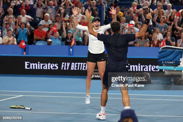 Roger Federer and Belinda Bencic of Switzerland celebrate winning the Hopman Cup final against Alexander Zverev and Angelique Kerber of Germany on...
