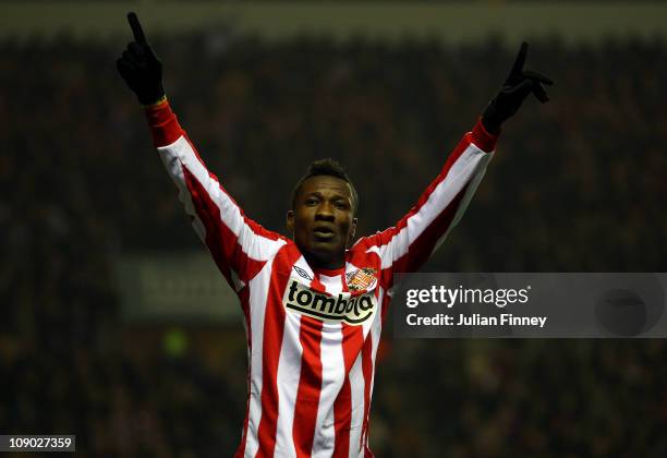 Asamoah Gyan of Sunderland celebrates scoring the first goal during the Barclays Premier League match between Sunderland and Tottenham Hotspur at the...