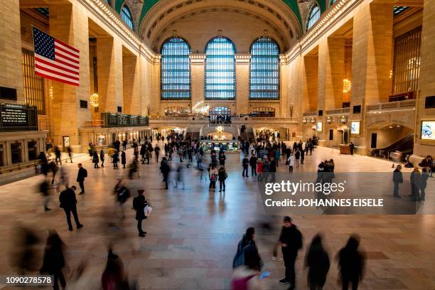 Commuters and tourists are seen in the Main Concourse of the Grand Central Station in midtown Mahhattan on January 27, 2019 in New York City.