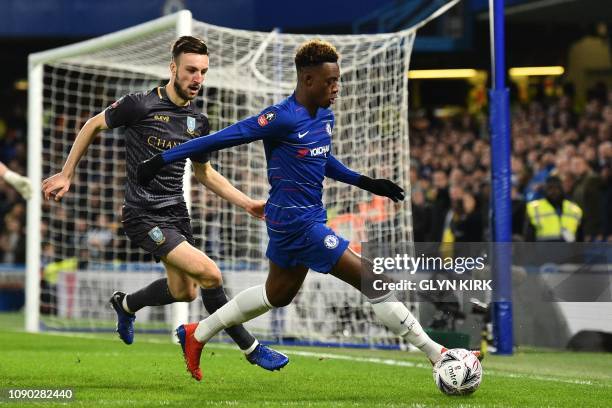 Chelsea's English midfielder Callum Hudson-Odoi is challenged by Sheffield Wednesday's Welsh defender Morgan Fox during the English FA Cup fourth...