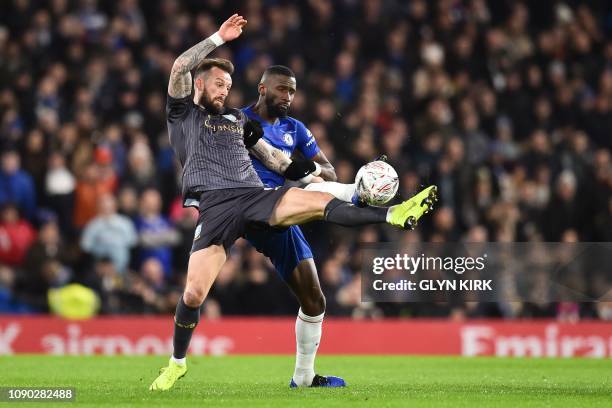 Chelsea's German defender Antonio Rudiger challenges Sheffield Wednesday's Scottish striker Steven Fletcher during the English FA Cup fourth round...