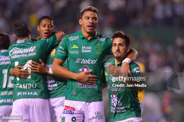 Walter Gonzalez of Leon celebrates with teammate Fernando Navarro after scoring the first goal of his team during the first round match between Leon...