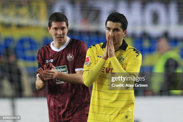 Nuri Sahin of Dortmund and Jiri Bilek of Kaiserslautern react during the Bundesliga match between 1. FC Kaiserslautern and Borussia Dortmund at...