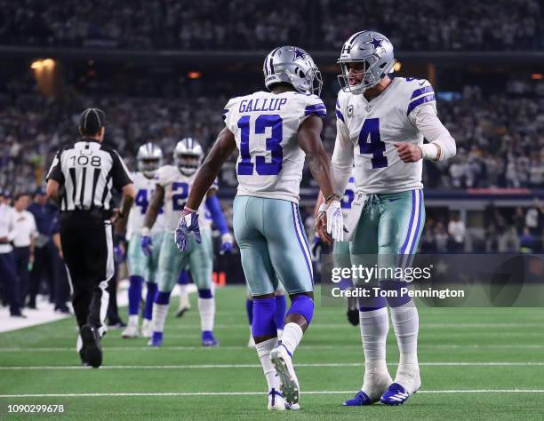 Michael Gallup celebrates his touchdown with Dak Prescott of the Dallas Cowboys against the Seattle Seahawks in the second quarter during the Wild...