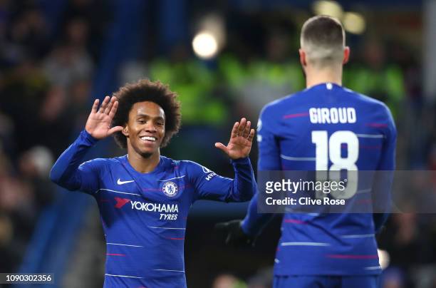 Willian of Chelsea celebrates after scoring his team's third goal with Olivier Giroud of Chelsea during the FA Cup Fourth Round match between Chelsea...