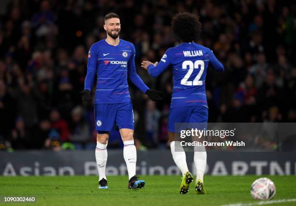 Willian of Chelsea celebrates after scoring his team's third goal with Olivier Giroud of Chelsea during the FA Cup Fourth Round match between Chelsea...