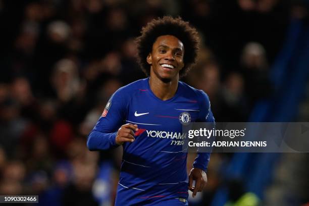 Chelsea's Brazilian midfielder Willian celebrates scoring their third goal during the English FA Cup fourth round football match between Chelsea and...