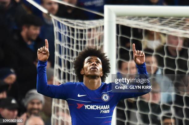 Chelsea's Brazilian midfielder Willian celebrates scoring their third goal during the English FA Cup fourth round football match between Chelsea and...