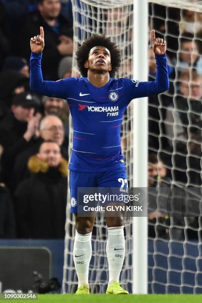 Chelsea's Brazilian midfielder Willian celebrates scoring their third goal during the English FA Cup fourth round football match between Chelsea and...