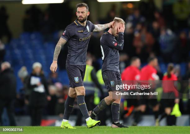 Steven Fletcher of Sheffield Wednesday and Barry Bannan of Sheffield Wednesday look dejected after the FA Cup Fourth Round match between Chelsea and...