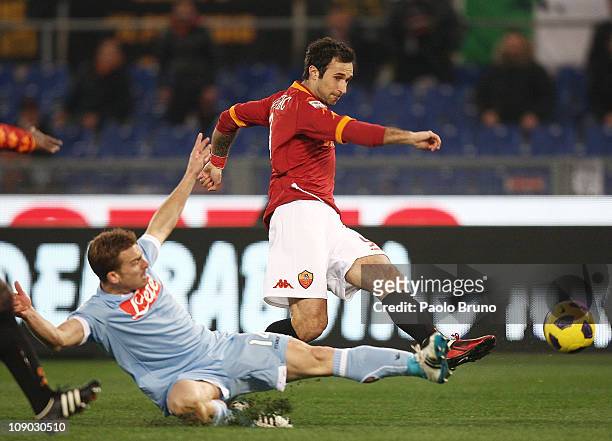 Hugo Armando Campagnaro of SSC Napoli competes for the ball with Mirko Vucinic of AS Roma during the Serie A match between AS Roma and SSC Napoli at...