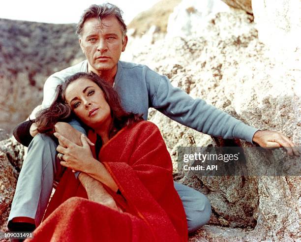 Elizabeth Taylor and Richard Burton on the film set of "The Sandpiper" in 1965.