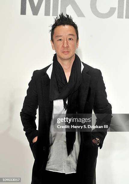 Designer Eric Kim poses backstage at the Mik Cire by Eric Kim Fall 2011 fashion show during Mercedes-Benz Fashion Week at The Studio at Lincoln...