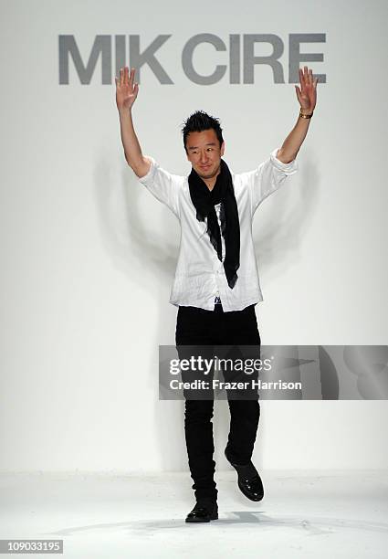 Designer Eric Kim walks on the runway at the Mik Cire Fall 2011 fashion show during Mercedes-Benz Fashion Week at Lincoln Center on February 12, 2011...