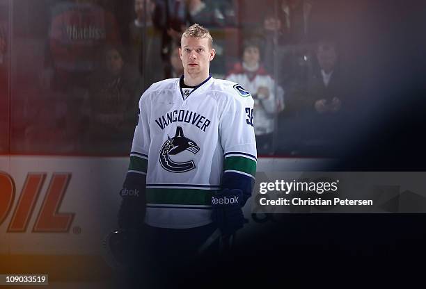 Jannik Hansen of the Vancouver Canucks stands attended for the singing of the National Anthem before the NHL game against the Phoenix Coyotes at...