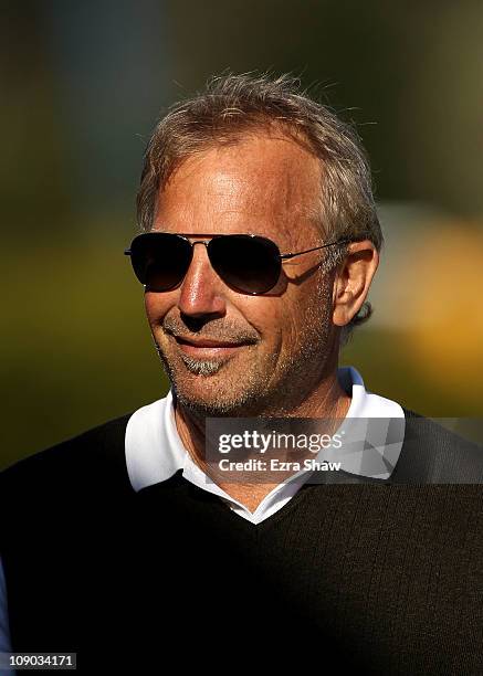 Actor Kevin Costner stands on the side of the 17th green during the third round of the AT&T Pebble Beach National Pro-Am at the Pebble Beach Golf...