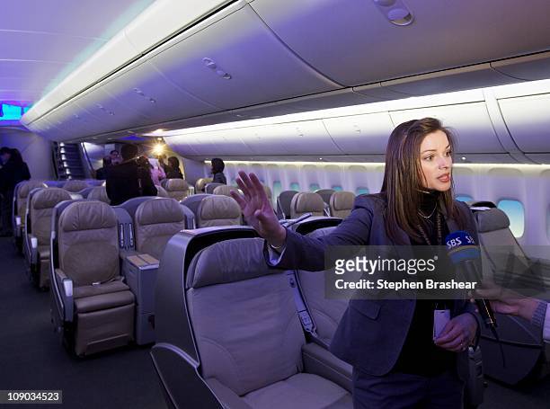 Boeing employee Colleen Rainbolt answers questions about the newly redesigned interior of the 747-8 Intercontinental, Boeing's newest passenger...
