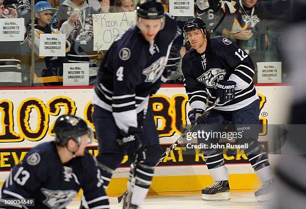 Mike Fisher of the Nashville Predators is welcomed by fans as he skates warmups against the Colorado Avalanche on February 12, 2011 at Bridgestone...