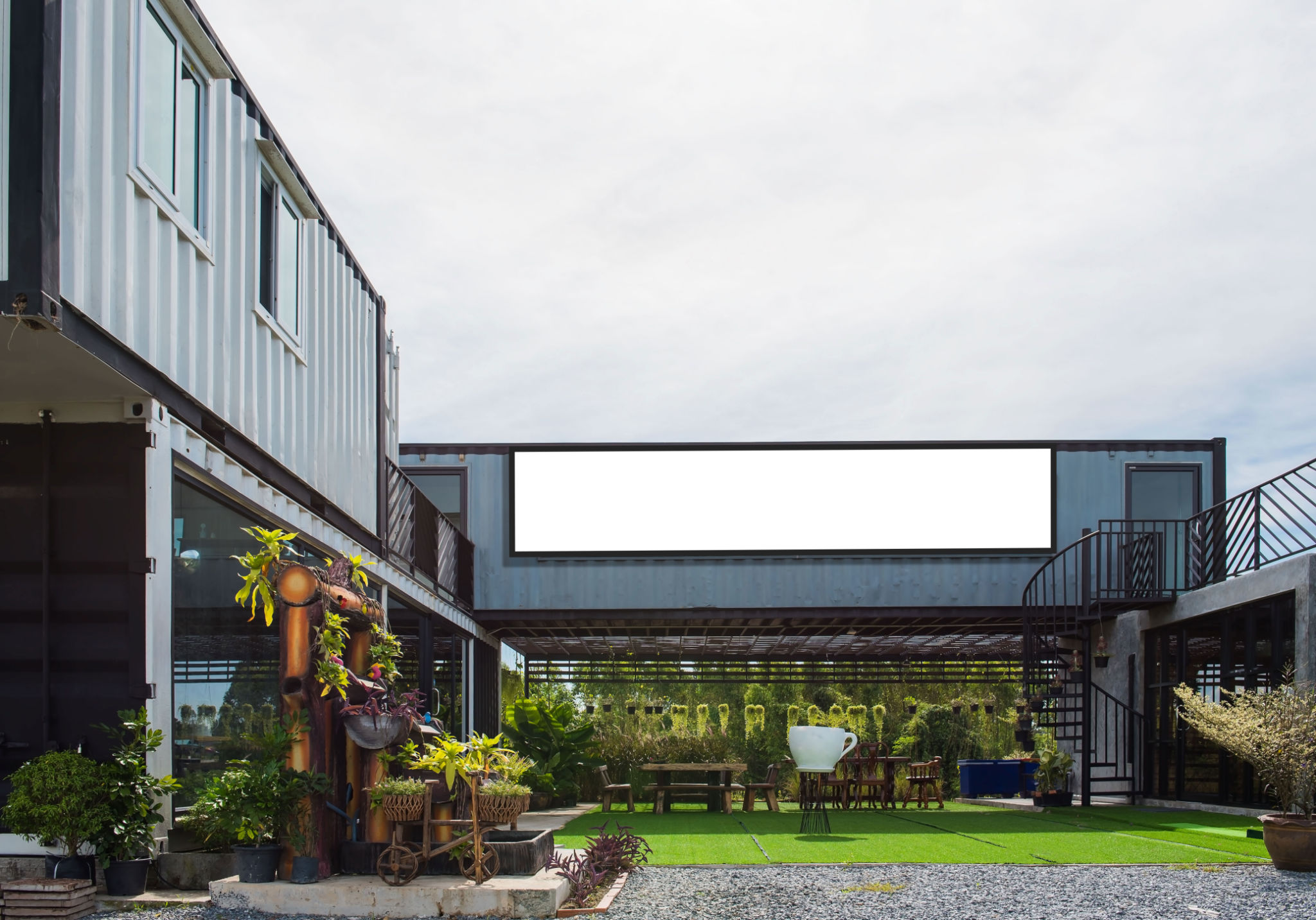Modern metal building made from shipping house containers and blue sky background . Modern metal building made from shipping house containers and blue sky background .